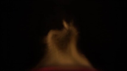Sticker - abstract slow motion of rising heat distortion above a subtle flame against a dark background subtle
