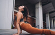 © BullRun - Focused woman practicing upward-facing dog close-up, looking upward with serene expression. Conceptual stock photo representing mindfulness, empowerment, digital lifestyle, and wellness.