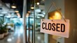 © perfectlab - Minimalist closed sign with bold letters hanging in glass office door under daylight