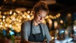 © Yuka - establishment. Small business owner focused on work at restaurant table with blurred background. pitch deck slides, case study pages, designed for brand storytelling and e-commerce strategy.