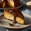 © Welington Campelo  - A slice of bolo de cenoura with chocolate topping served on a dessert plate with fork