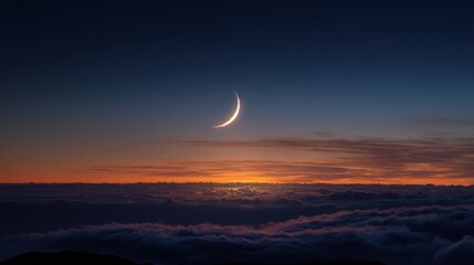 Wall Mural - A delicate crescent moon hangs in the dusky sky above a vast sea of clouds casting a soft glow as the day transitions to night. The horizon shows warm colors fading away.