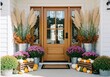 © Julija - Brown wooden front door decorated with fall mums and pumpkins. Autumn home porch decor for Thanksgiving or Halloween.