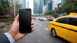 © Johannes - closeup of businessman using smartphone on street to call a taxi cab detail of  black hand holding mobile phone while using high speed internet connection closeup of empty screen of cellphone no logo