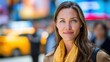© J. Grayscale - Confident Young Woman Smiling in Busy Urban Setting with Yellow Scarf