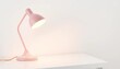 © Thiti - A pastel pink table lamp illuminates a pristine white surface,  bright,  clean