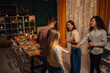 © Zamrznuti tonovi - Friends celebrating thanksgiving with festive dinner and dancing