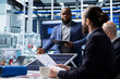 © DC Studio - Photovoltaics factory manager presenting solar panel automation strategies during business meeting. Solar panels plant specialist showing shareholders ways to enhance manufacturing processes