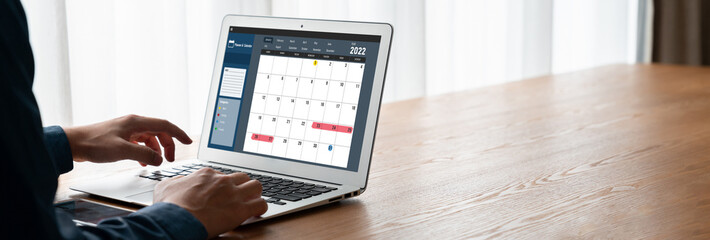 Wall Mural - Calendar on computer software application for modish schedule planning for personal organizer and online business