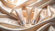 © Seckin Ozturk - Tinted Moisturizer Tubes on Silk Cloth. Cosmetics concept. Generated Image