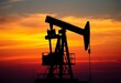 © Tanapong - Silhouette of oil pump jack at sunset, vibrant sky, energy industry,  vibrant,  energy