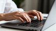 © tai - A close - up view of hands actively typing on a laptop keyboard, representing digital work or study activities.