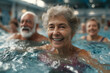 © john - A group of active seniors participate in a lively water aerobics class, performing synchronized movements in an indoor swimming pool