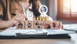 © SnapGlint - Person stacks wooden blocks with business icons—target, handshake, globe, team—forming pyramid structure, evoking strategy, collaboration, and goal-setting in minimalist organizational symbolism compo