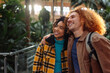 © bernardbodo - Happy tourist couple visiting train station in madrid