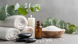 Spa Composition With Eucalyptus Branches, Towels, and Stones