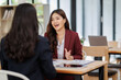 © David - Two Young Asian businesswoman Business team Analysis Business Accounting working with Individual income tax return Accounting concept