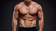 © Ksu_Sha - Muscular male torso with defined abs and chest covered in sweat against dark background
