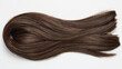 © valeo5 - A close-up, horizontal studio shot of a thick, wavy lock of luxurious dark brown hair with subtle auburn highlights, showcasing smooth texture, shine, and healthy volume, isolated on white background.