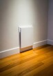 © facegolf - Modern Wall Mounted Cabinet - Modern white wall mounted cabinet against a cream wall. A wooden floor is in the foreground