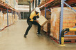 © ฺฺฺBoonterm - Male workers strength lift heavy boxes merchandise on their shoulders move them  distant shelves and risk injury or accidents from repeatedly lifting heavy items without weight lifting equipment.