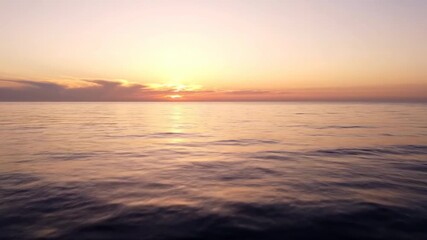 Wall Mural - Serene panning shot across a vast expanse of calm ocean surface at sunrise pink, open, movement