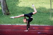 © luengo_ua - Young athlete girl practices elegant handstand outdoors, demonstrating skills, flexibility, and dedication, physical fitness and graceful movements in rhythmic gymnastics.