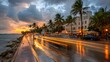 © Aril - A vibrant coastal scene at sunset, showcasing a wet street lined with palm trees, restaurants, and buildings, bathed in warm golden hues.