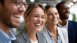 © Kateryna Arkhypova - A team of professionals giggling together in a relaxed office setting, business team laughter, workplace colleagues fun, corporate bonding moment, office joy atmosphere, with copy