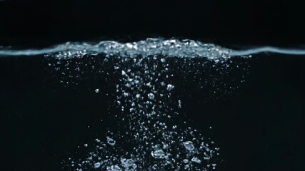 Wall Mural - dynamic close-up of clear water splashing and swirling, creating intricate patterns and bubbles in s