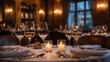 © Alicia - Elegant candlelit dinner setting with wine glasses and soft lighting in a cozy restaurant