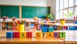 © skdesign - Colorful blocks spell Head Start in a cheerful classroom filled with school supplies and bright learning spaces for young children