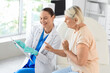 © Pixel-Shot - Senior woman with doctor after vaccination in clinic