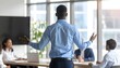 © Hamky - Speaker addressing audience in a modern conference room with colleagues listening attentively