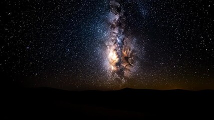 Wall Mural - spectacular galactic center rises over a silhouetted desert horizon, revealing the heart of the milk