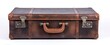 © ckybe - The vintage leather suitcase with metal latches sits closed on a white backdrop