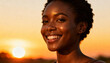 © Jan - Vibrant young African woman smiling joyfully in golden sunset light, natural beauty, radiant skin, happiness and positivity, outdoor portrait with warm glowing background, serene mood