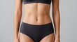 © Nazlykhan - Fitness and wellness concept featuring athletic female figure in black activewear