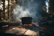 © AJ Studio - Cooking over a campfire in a forest campsite with smoky pot and glowing firewood ambiance