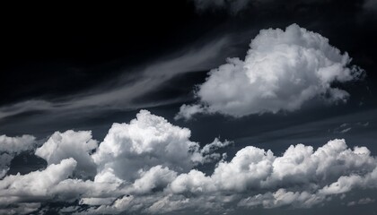 Wall Mural - a black and white photo of a cloudy sky with a few clouds that are white