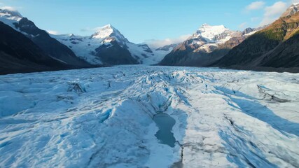 Wall Mural - ﻿Majestic glacier slowly melts, revealing intricate ice patterns under changing sunlight in a high-altitude timelapse ice patterns, flow, slowly melts