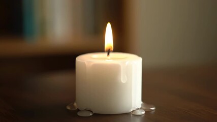 Wall Mural - Timelapse of a single white candle burning down, wax melting and wick shortening, producing a gentle, flickering flame abstract, meditation, wick shortening