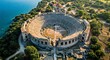 © Husnain - “Aerial view of Butrint ruins with ancient amphitheater and surrounding nature.”_073305_PerfectlyClear