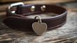 © Kevin - Leather dog collar with heart tag on wooden background