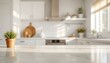 © Arreeya - Marble countertop of an upscale modern kitchen with a potted plant sitting gracefully in the morning sunlight