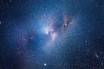 Wall Mural - A vibrant watercolor depiction of a luminous galaxy against a star-filled sky.