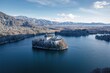 Drone aerial perspective of a lake near the southwestern edge of a city