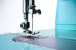 © KrisTheKris - light blue vintage sewing machine on white background