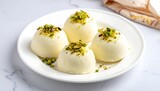Creamy pistachio-topped desserts on a plate