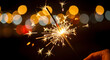 © Sheikhmudassir71 - Sparkler emitting bright light against dark background.